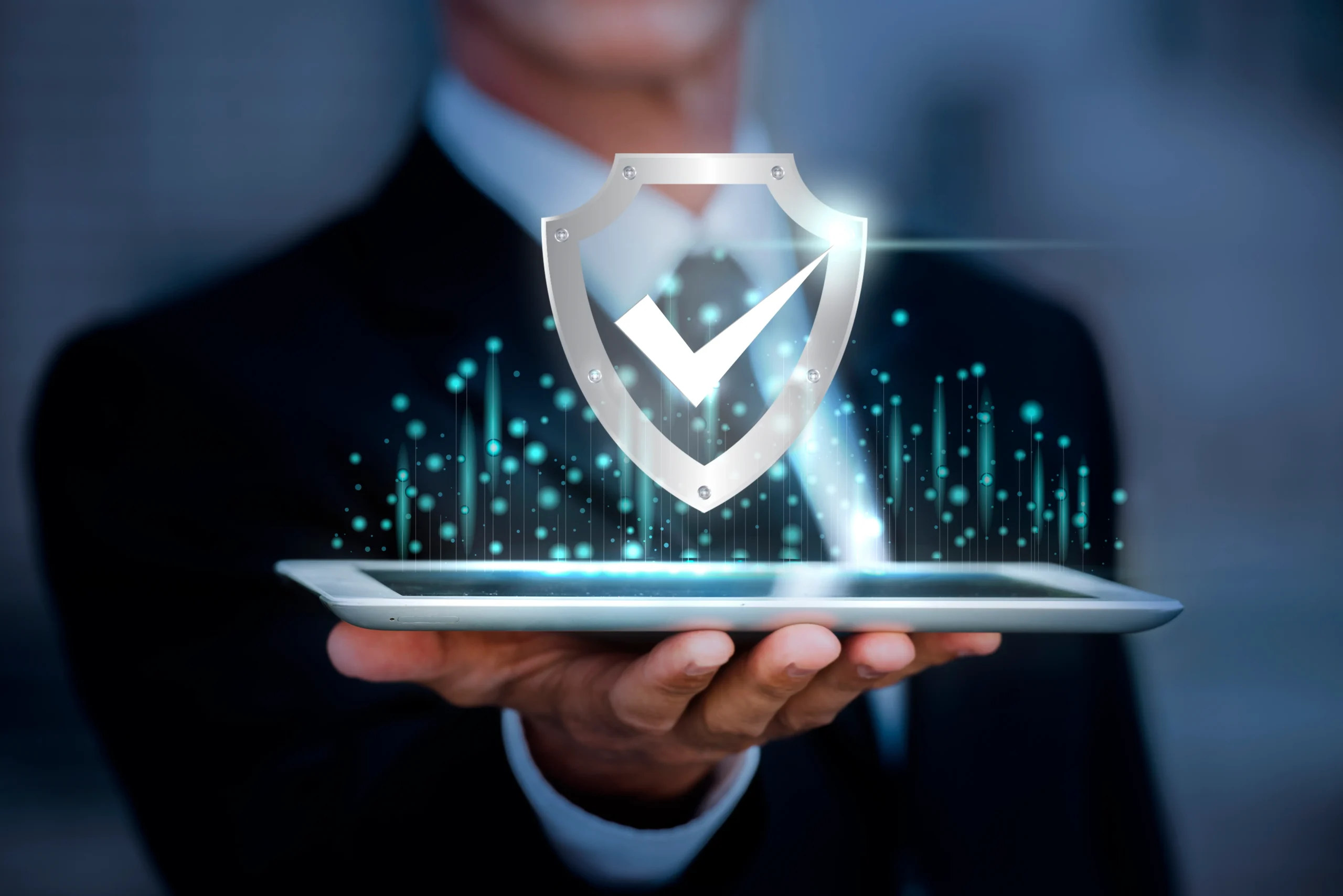 A man holding a tablet with the logo of security for cmmc 2.0 requirements