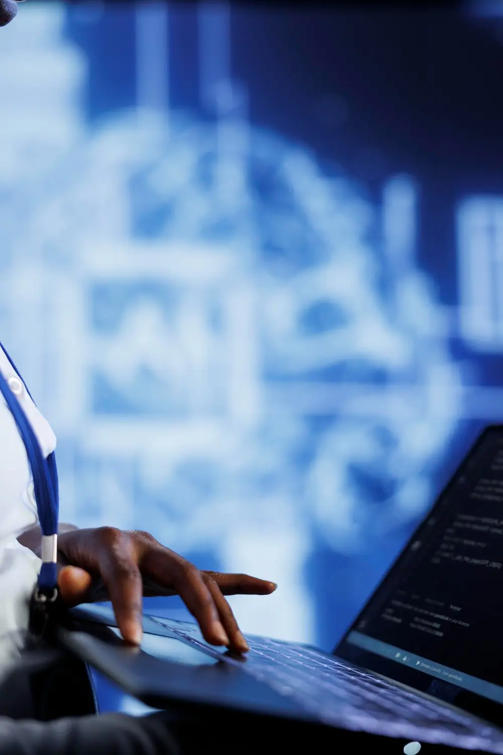 IT Specialist for CaaS working on a laptop