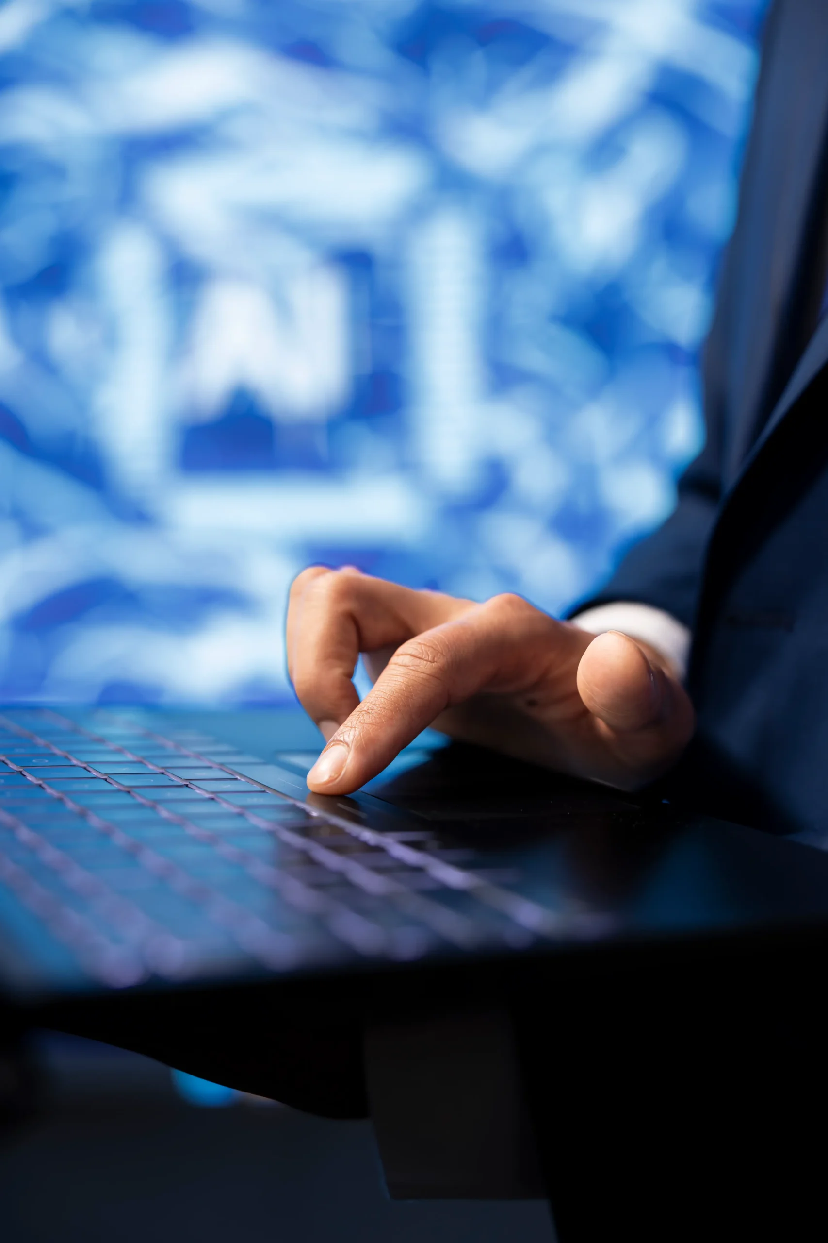 IT specialist programming in a laptop for compliance as a service