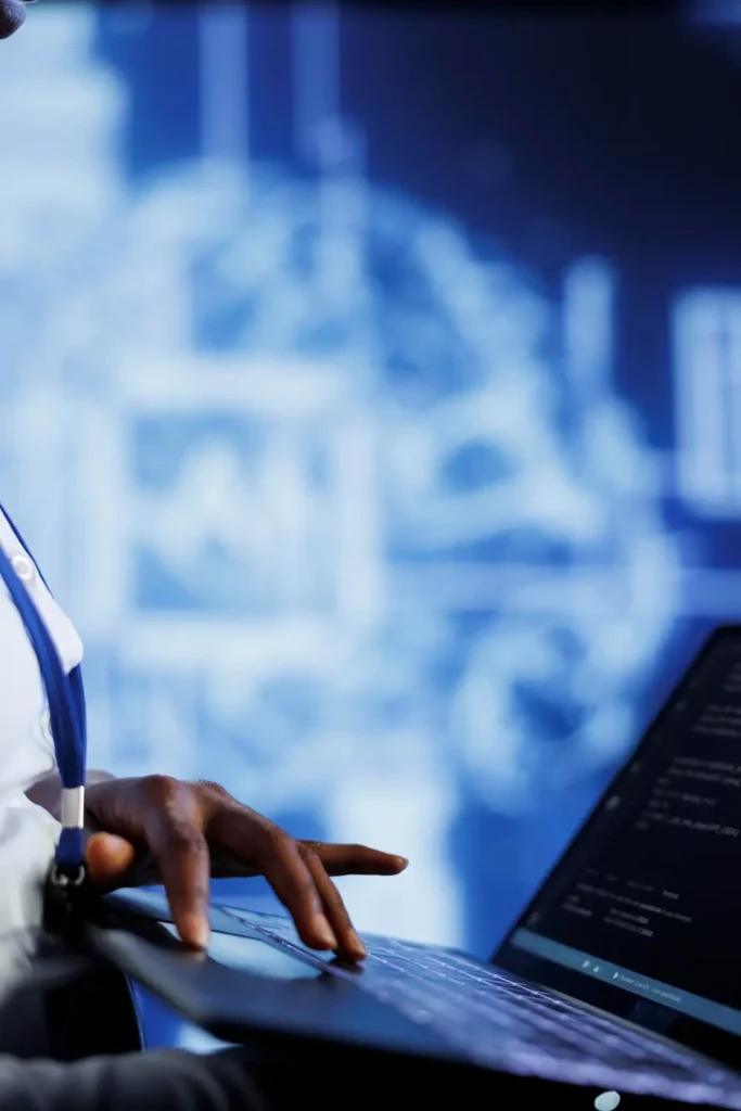 An it managed services professional holding a laptop